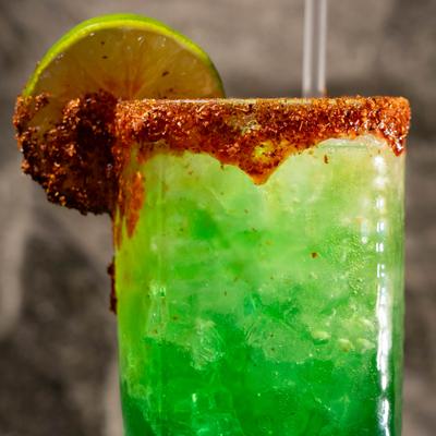 Green cocktail with chili rim.