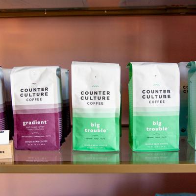 Counter Culture Coffee bags on a shelf.