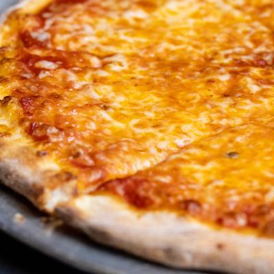 Traditional Cheese Pizza, close up.