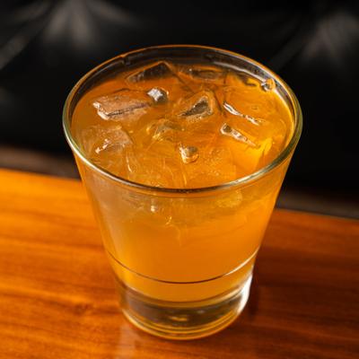 Cocktail served on ice in a lowball glass.