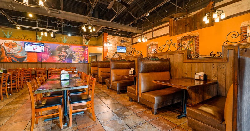 Interior, seating area, tables on the left, booths on the right