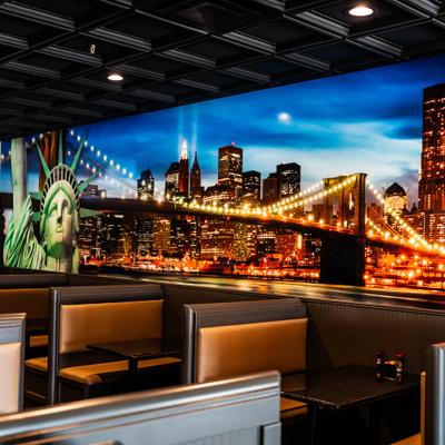 Mural depicting the New York City skyline with Statue of Liberty.