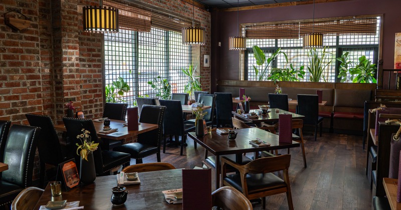 Interior, dining area with chandeliers, leather chairs and tables