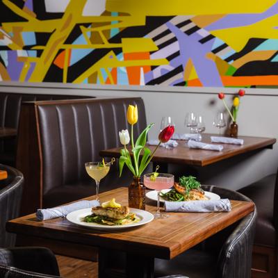 Dining table, with food, drinks, and tulips