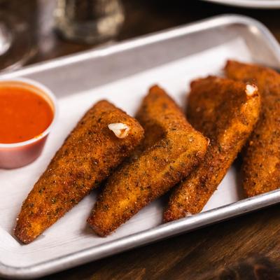 Mozzarella wedges served with marinara sauce.