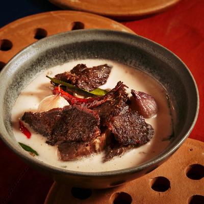 Grilled beef in creamy broth.