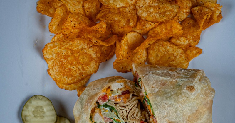 Chicken wrap with chips on the side