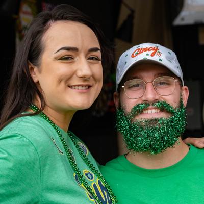 Two persons gressed for St. Patrick's Day.
