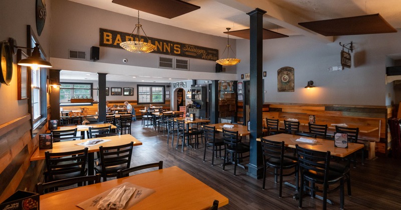 Interior, dining area,  tables and chairs ready for guests