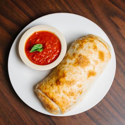 Stromboli with marinara sauce.