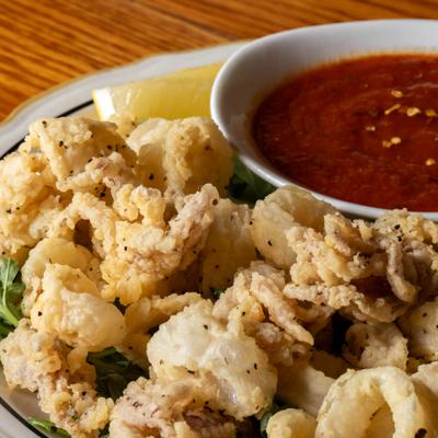 Fried calamari with spicy tomato sauce.