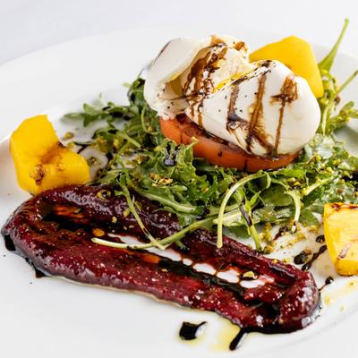 Salad with burrata, grilled peaches, fig jam, and balsamic.