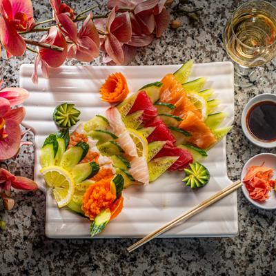 Tuna, salmon, red snapper, and shrimp masago sashimi.