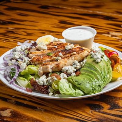Cobb Salad with grilled chicken, bacon, avocado, blue cheese crumbles and egg.