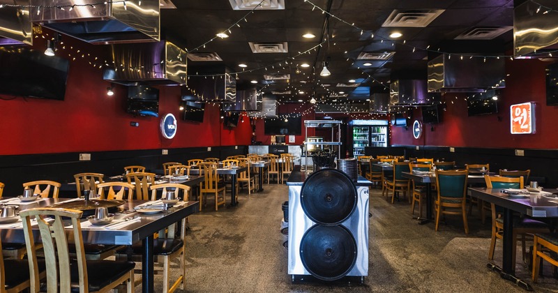 Inside space,  dining tables ready for guests