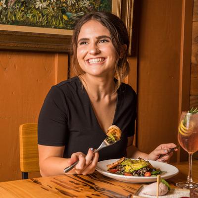 Customer holding fork and posing for photo