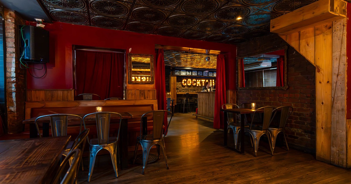 Seating place with red curtains on the door