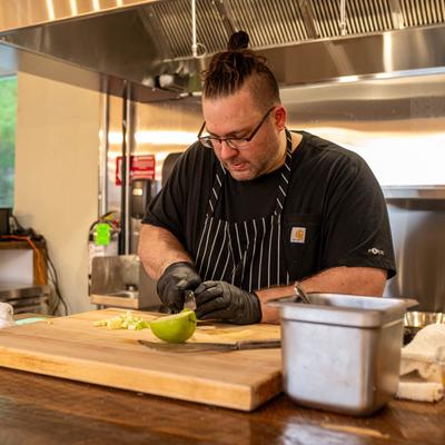 The chef preparing food.