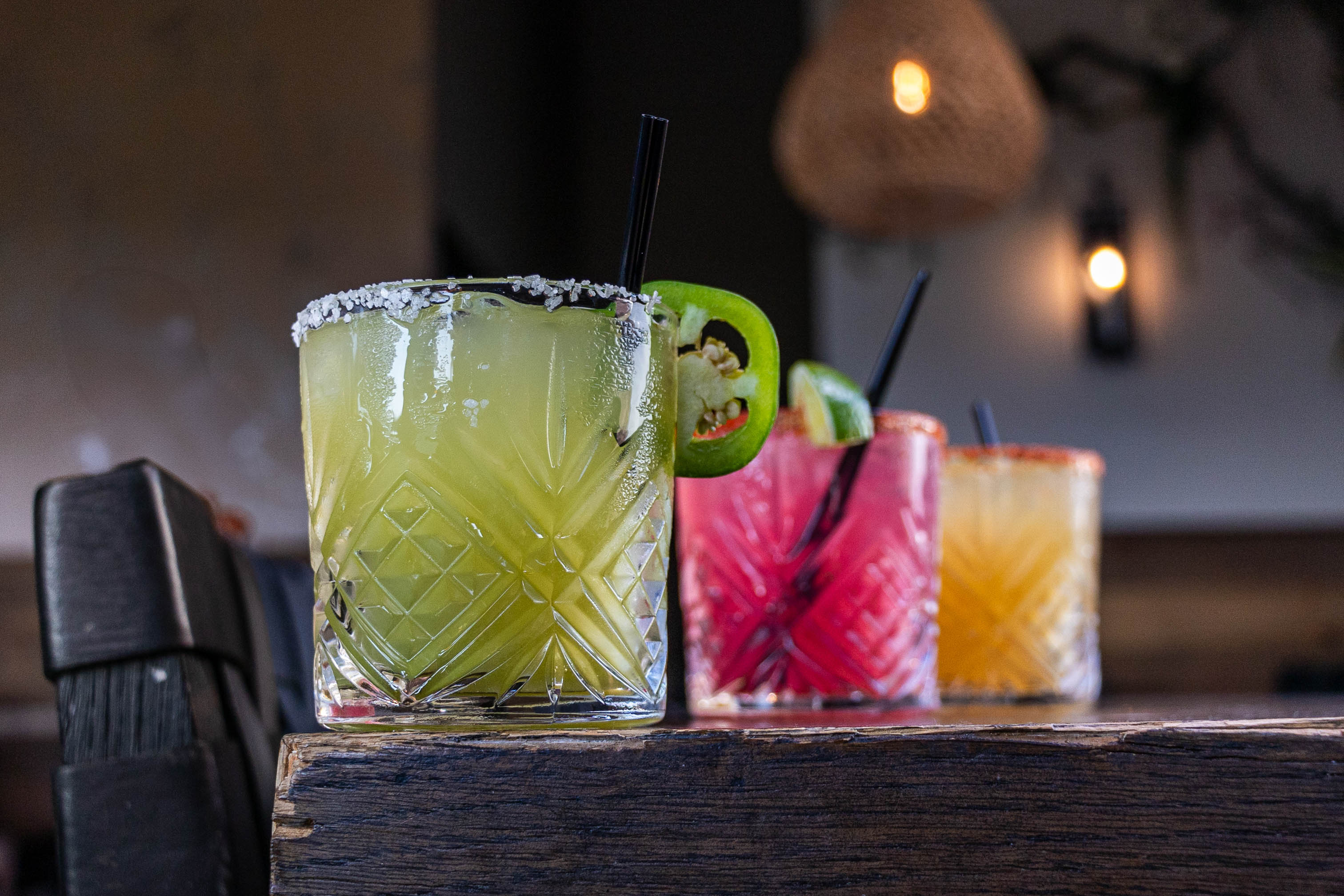 Three cocktails served on a table