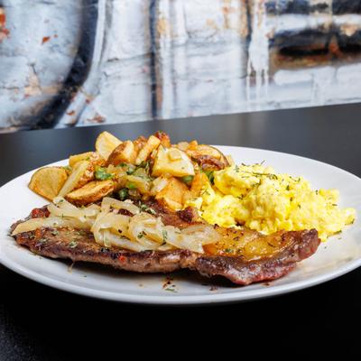 Creamy scrambled eggs, side view.