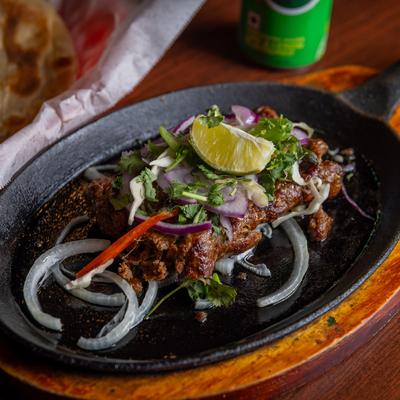 Beef Seekh Kebab, marinated in fresh herbs and spices.