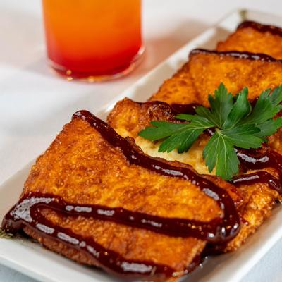 Fried cheese topped with guava sauce.
