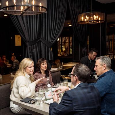Four guests at a table.