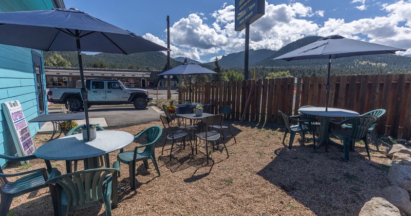 Outside, dining tables, chairs, parasols
