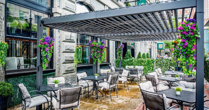 Exterior, partially covered seating area, large pergola with small ceiling lanterns