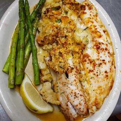 Broiled Stuffed Haddock, served with asparagus.