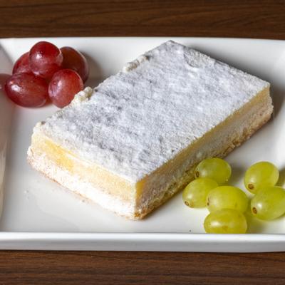 Lemon bar, served with grapes.