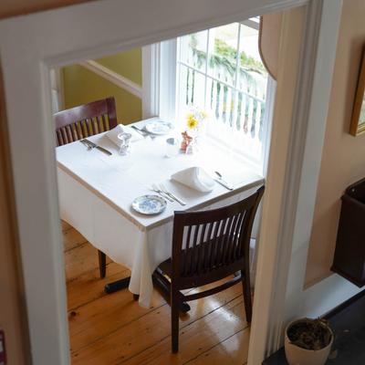 Interior, a set table next to a window.