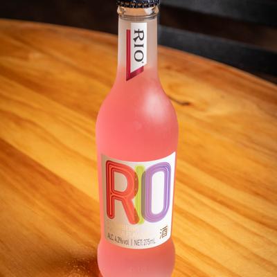 A bottle of Rio strawberry drink.