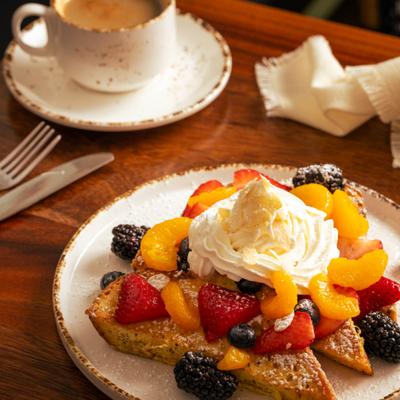 Grand Marnier French Toast served with a cup of coffee.