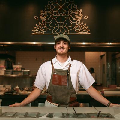 Chef standing on his station in the kitchen.