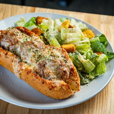 Meatball Sub, with Caesar salad.