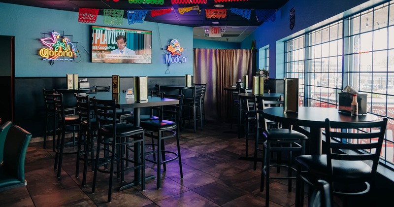 Seating area with tables and bar stools