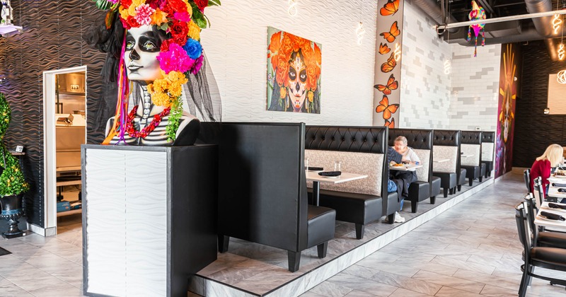 Interior, booths in dining area, Dia De Los Muertos decorations