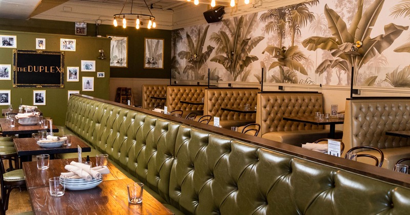 Interior, button tufted booths, tableware on dining tables