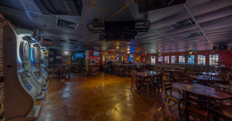 Inside, darts, wooden tables and chairs