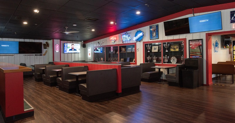 Specious interior seating area with lined-up upholstered booths
