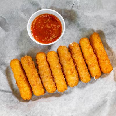 Mozzarella sticks with a dip on the side.