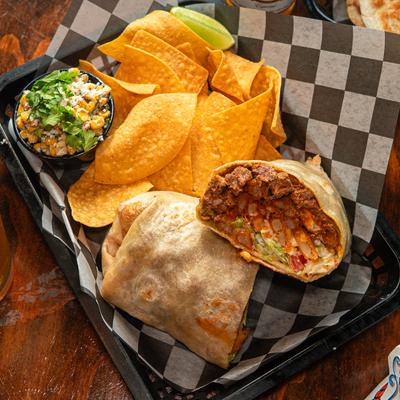 Beef burrito with tortilla chips and Mexican corn salad.