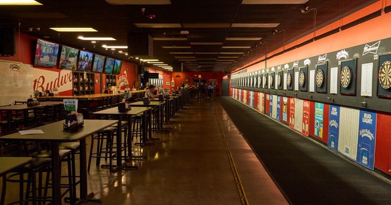 Seating area with tall tables and bar stools