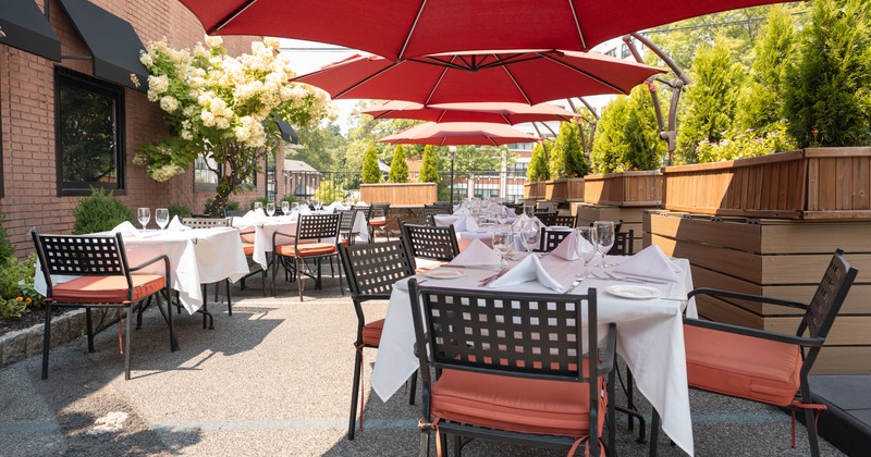 Exterior, patio area with tables and chairs ready for guests