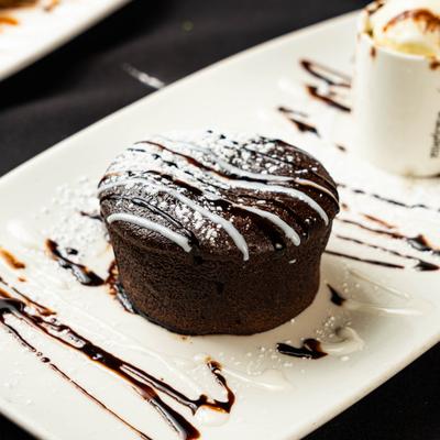 Chocolate lava cake served with vanilla ice cream.