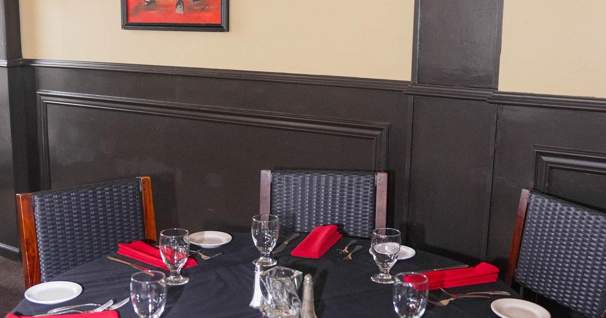 Interior, round tables with tableware