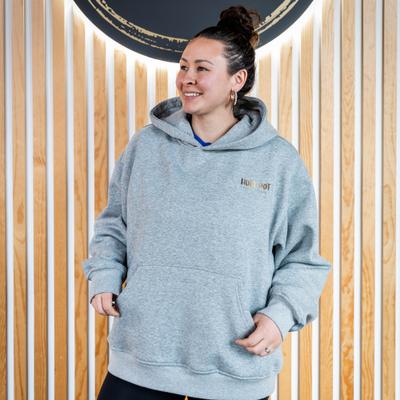 Woman in an light gray ''Hula Pot'' hoodie, front view, closeup.