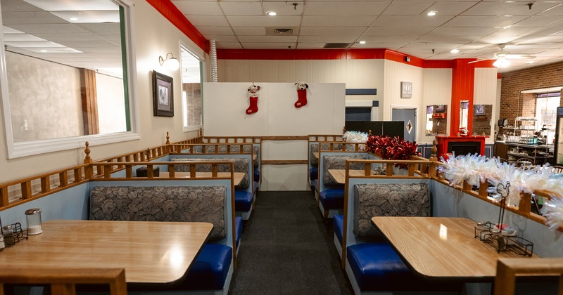 Cozy interior dining area, upholstered dining booths ready for guests