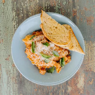 Bolognese pasta with ground veil, beef, pork, Parmesan, and basil.